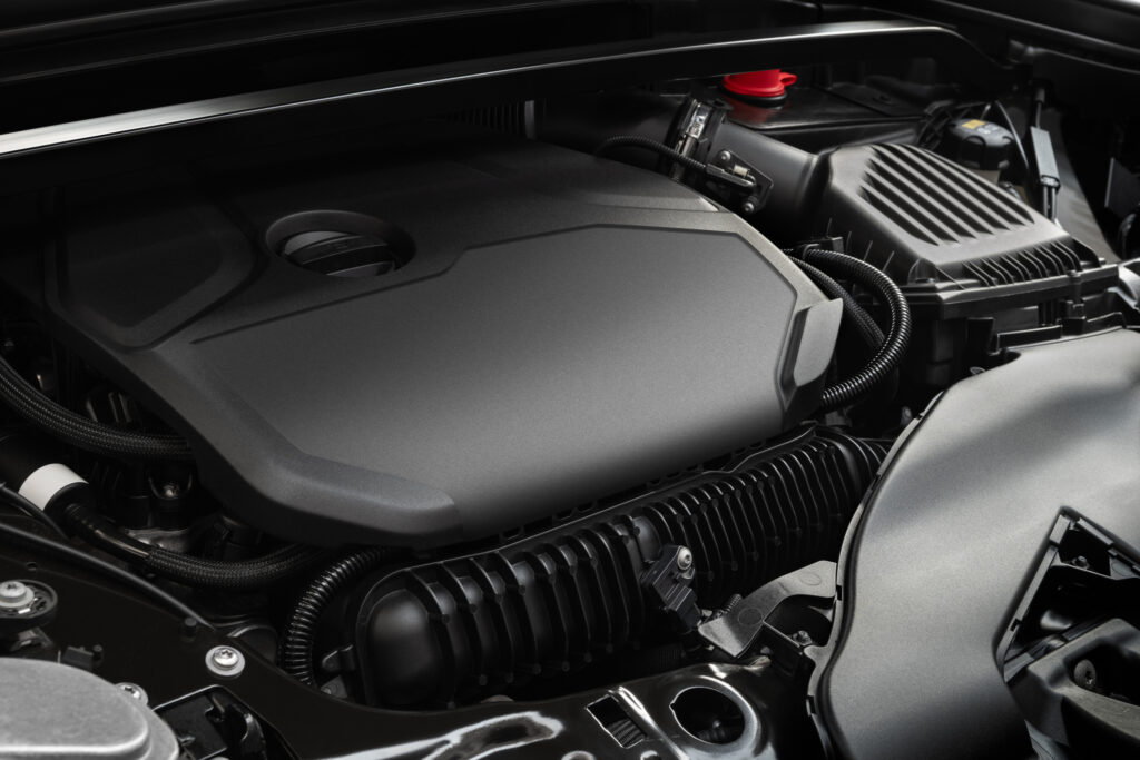 Modern car engine with engine cover under the hood. Clean engine bay.